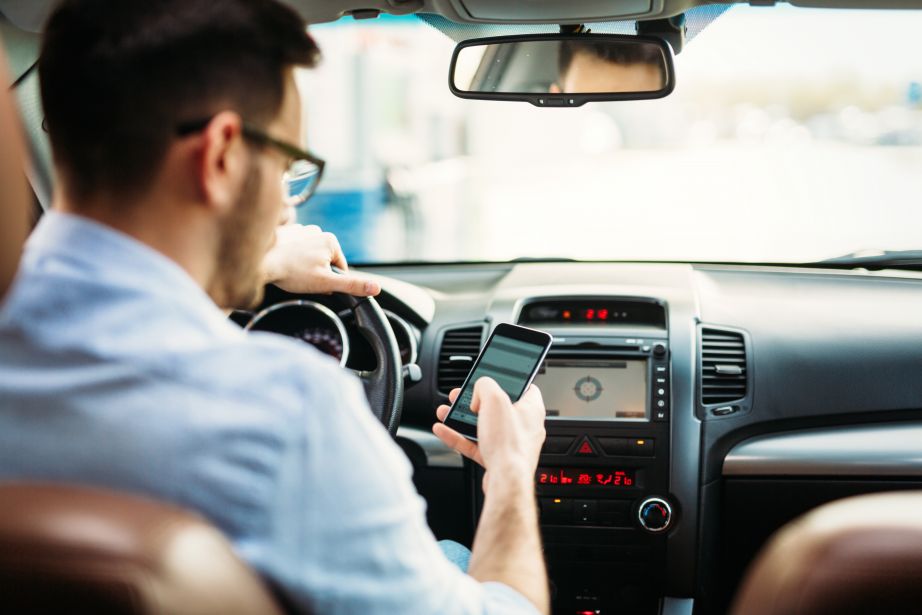 Man texting while driving